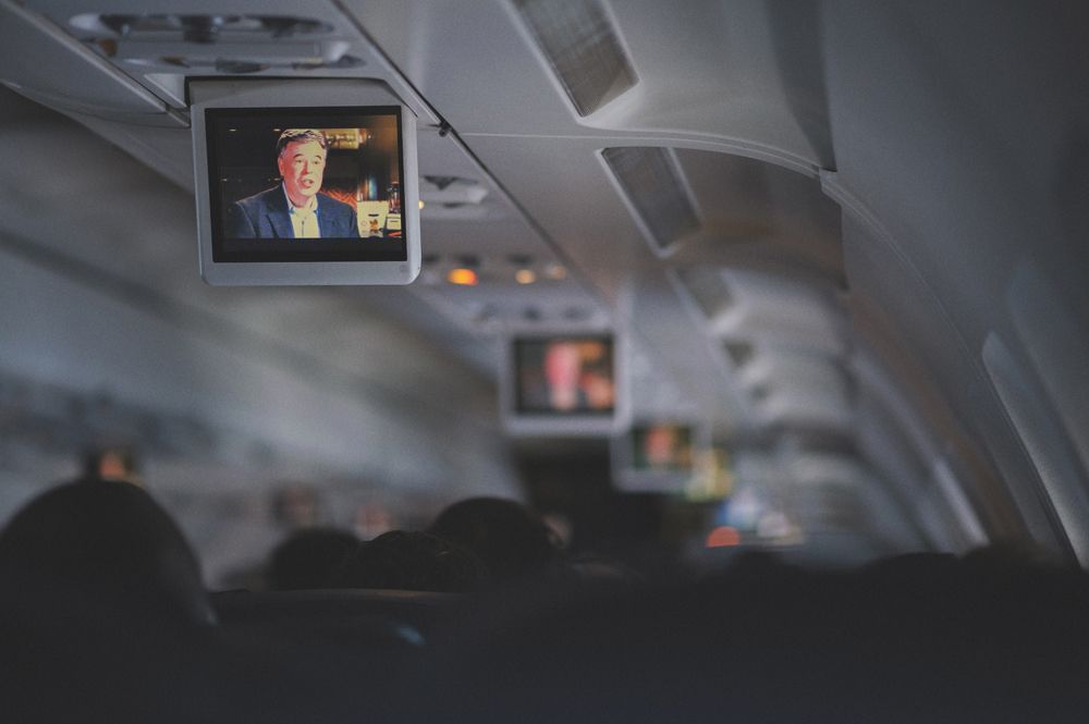 Wedding rings on a leaf, yellow shoes on stairs, and a dress hanging from a tree.