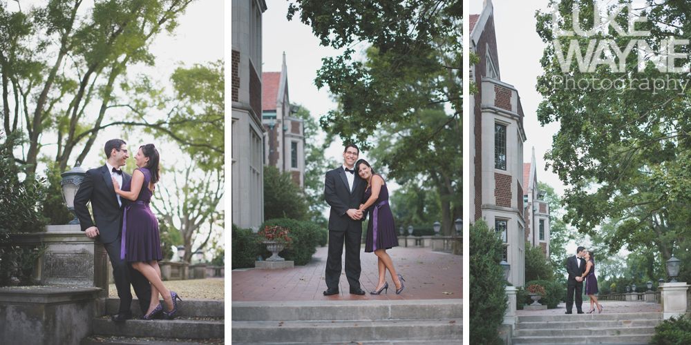 Couple poses on steps in front of a castle-like building, trees in the background. She wears a purple dress.