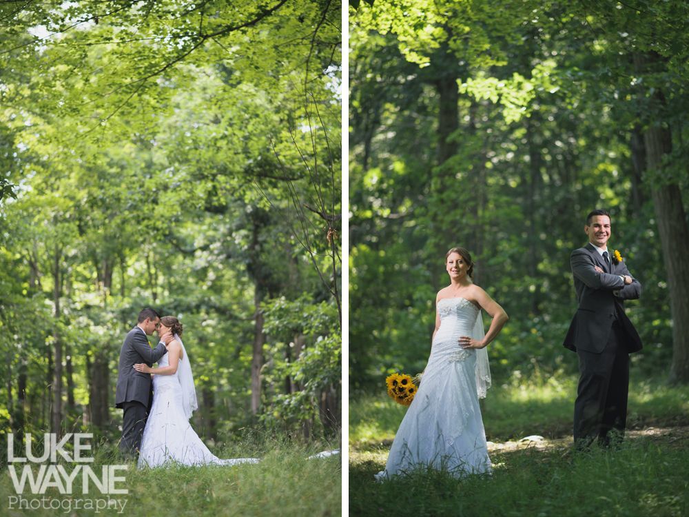 Wedding couple in forest; one embraced, one poses.