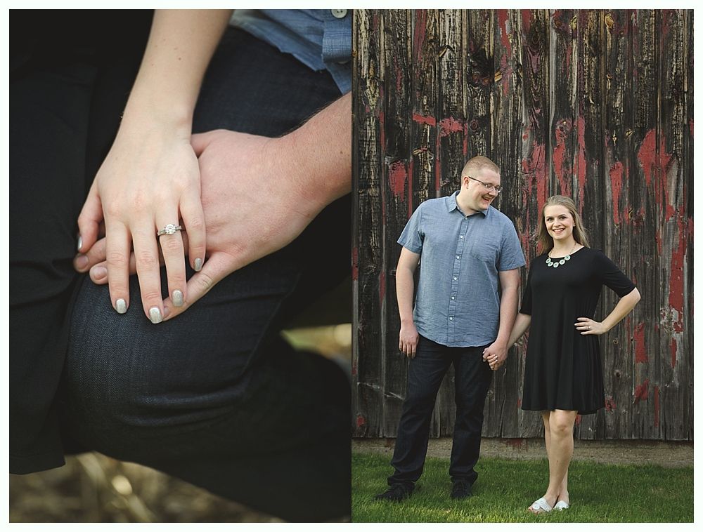 Two men in suits stand on a road. One has arms crossed, a yellow tie. The other is beside him, also in a suit, with dark sunglasses.