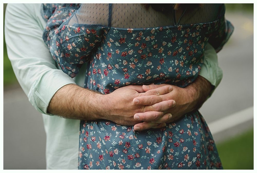 Wedding décor: seating chart, floral garlands, welcome sign, bar with disco ball lighting.
