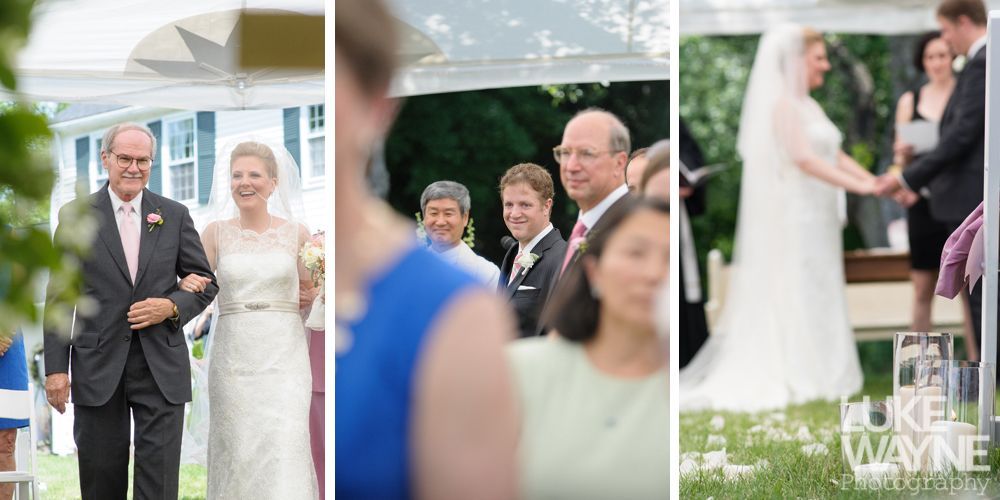 Bride walks down the aisle with her father at an outdoor wedding ceremony.