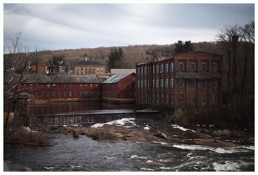 Triptych of wedding reception details: chandelier over table, drink station, and table setting with lights.