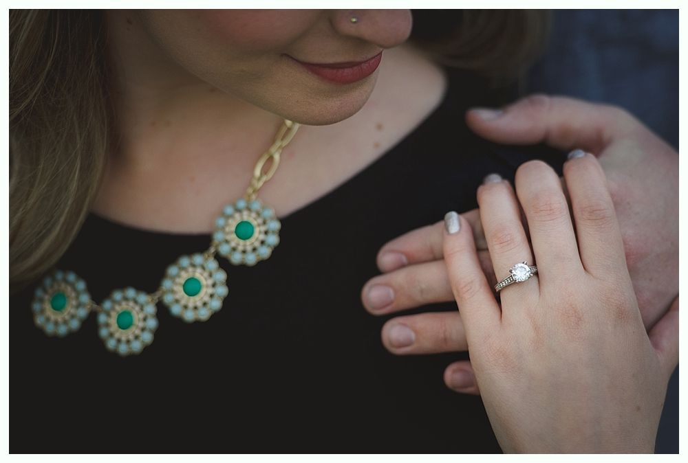 A windmill, weeping willow, and gazebo in a lush garden setting.