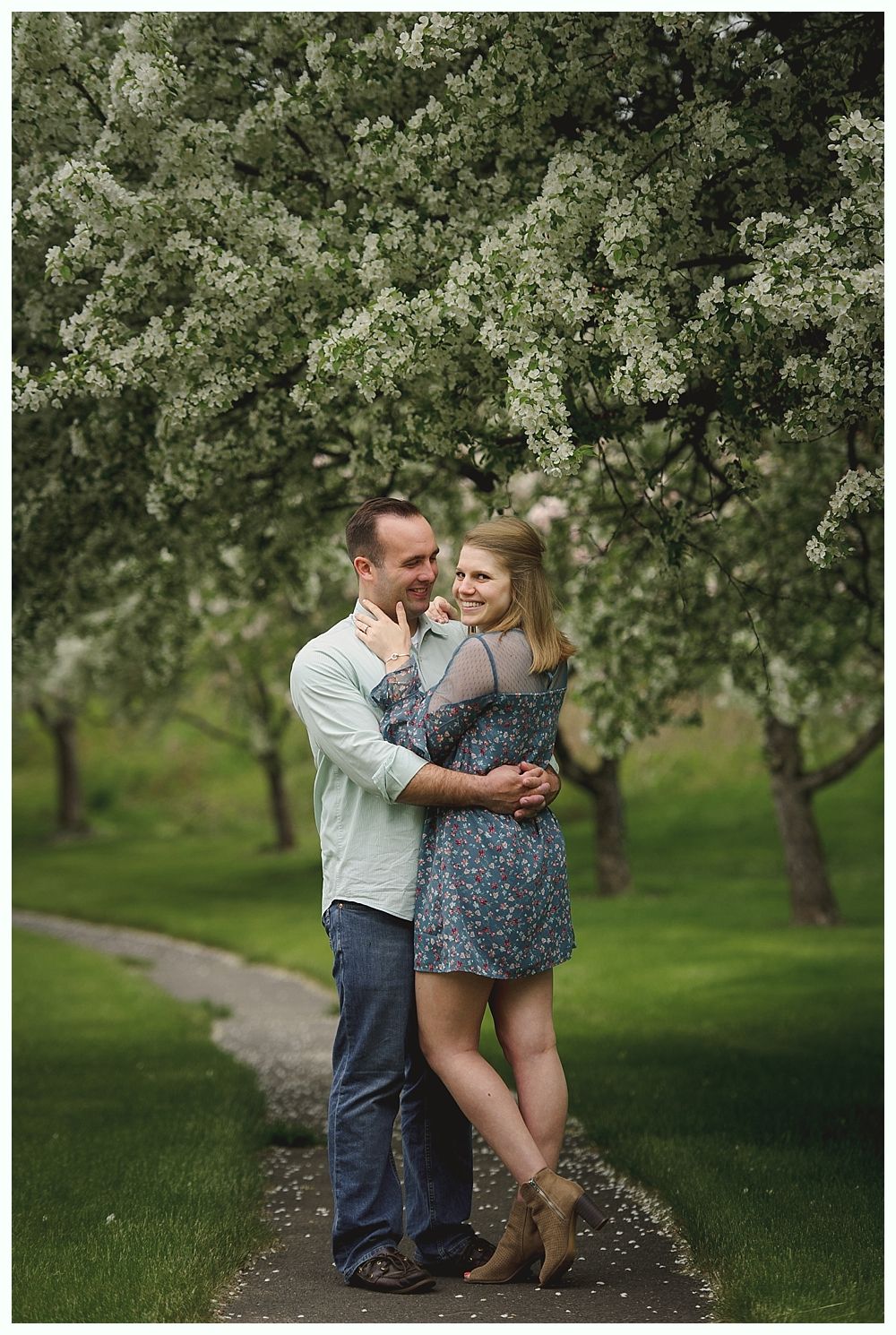 Wedding ceremony: Bride and groom walking toward barn, bridesmaids in red dresses holding bouquets.