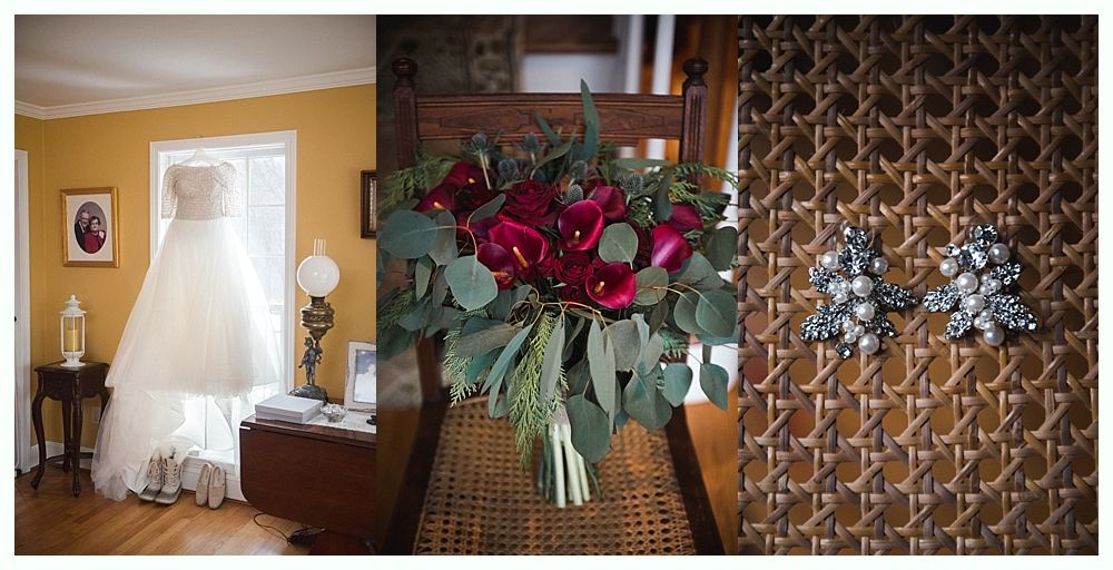 Wedding details: Earrings, veil with floral embroidery, and bouquet with dark red flowers.