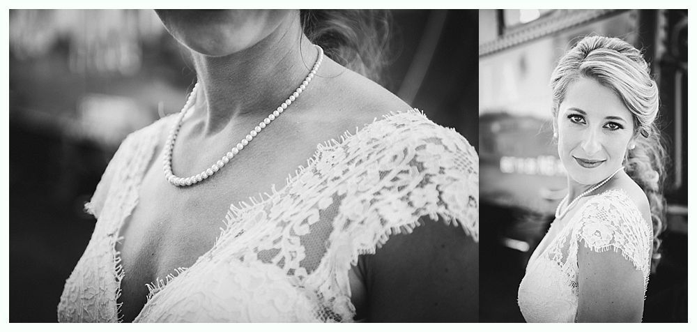 Bride in lace dress wearing a pearl necklace.