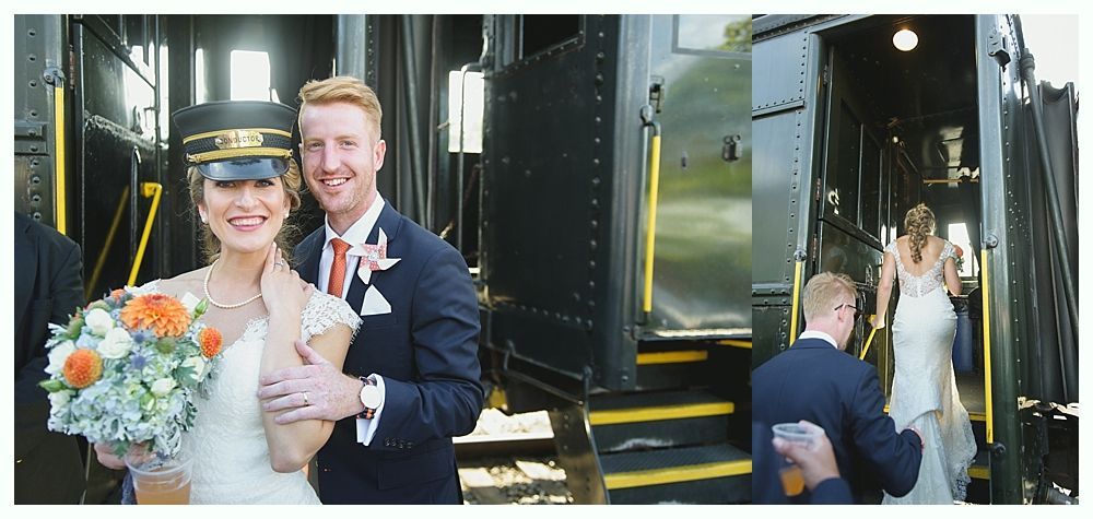 Bride and groom pose by a train. The bride wears a conductor hat, holding a bouquet. Another person enters the train.
