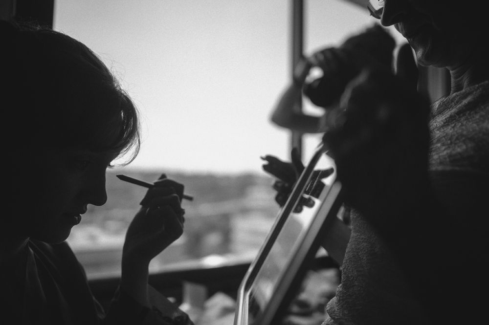 Wedding rings on a leaf, yellow shoes on stairs, and a dress hanging from a tree.