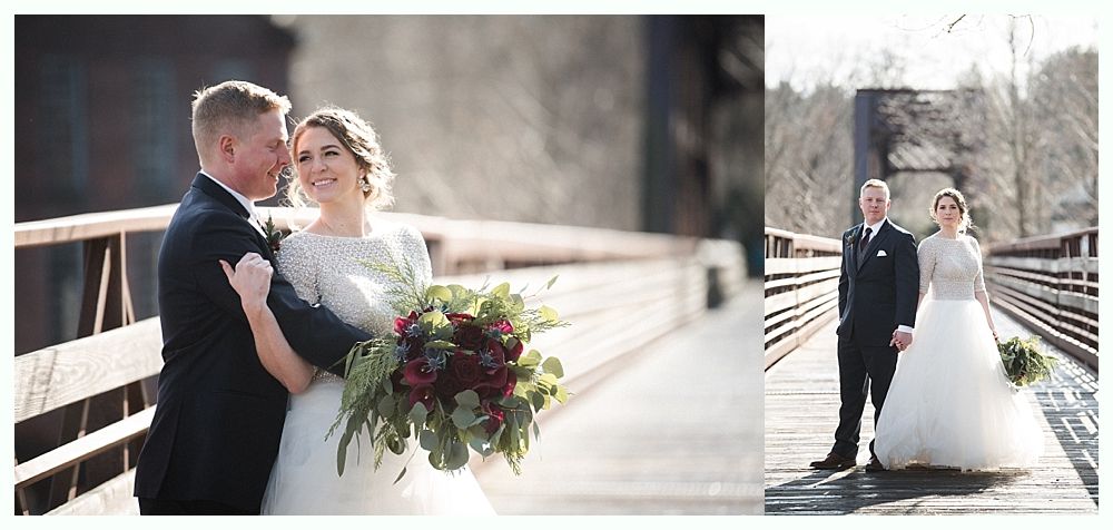 Woman in a crowd, smiling and resting her chin on her hand, at an outdoor event.