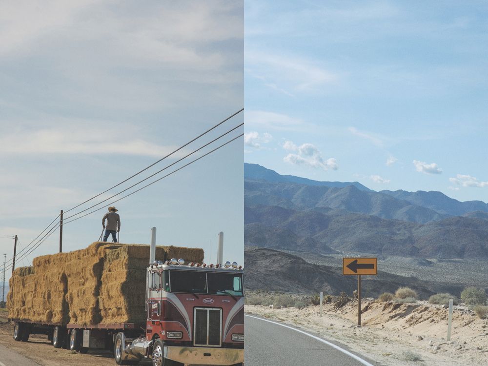Person taking photo in mirror, indoors; black and white.