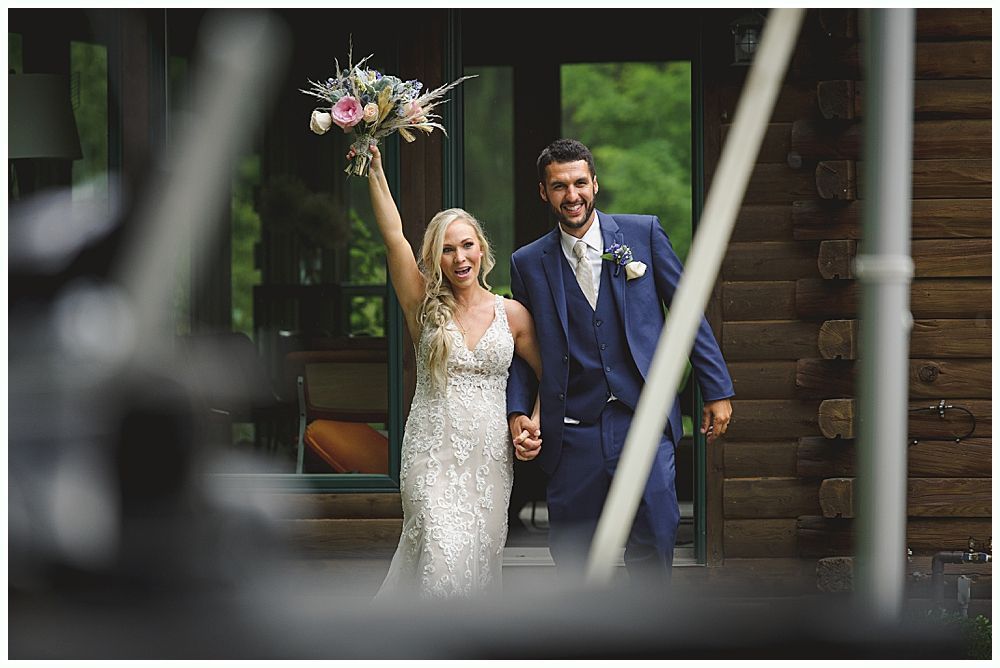 Wedding couple poses near trees, bride in a gown holds bouquet. One image shows them close, another shows them under a weeping willow.