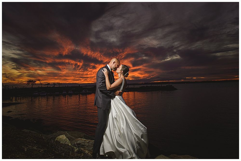 Wedding couple poses near trees, bride in a gown holds bouquet. One image shows them close, another shows them under a weeping willow.