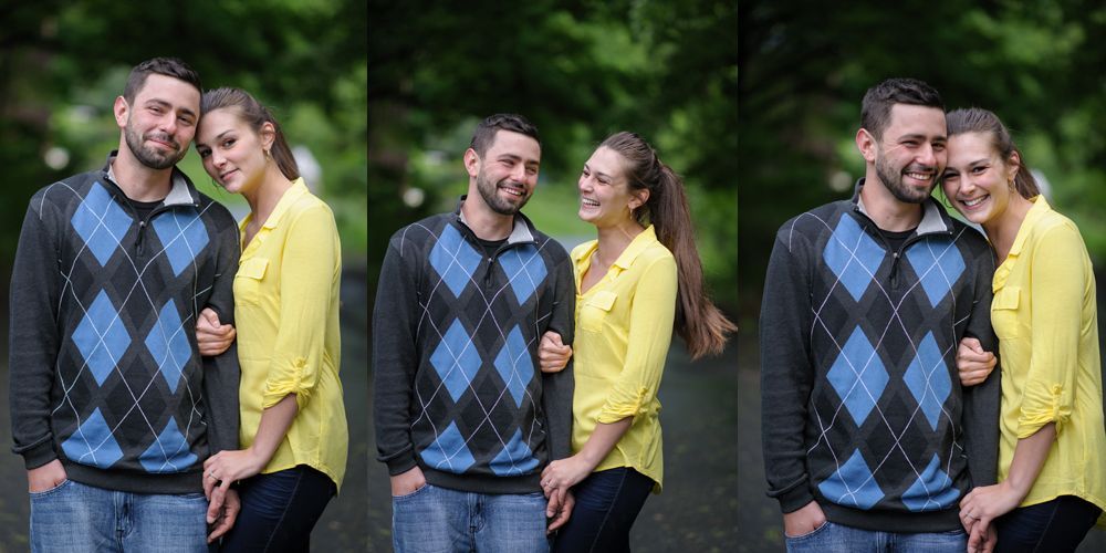 Man in suit looks out a window, checking his watch, waiting. Black and white.