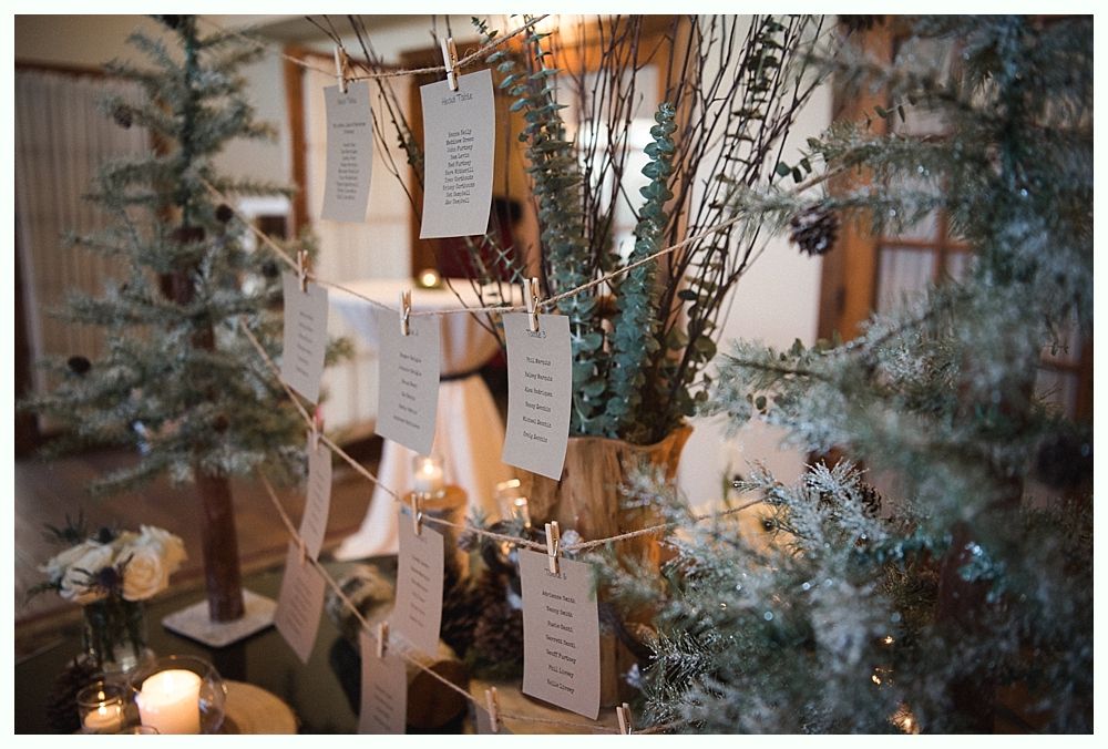 Man in suit laughing with mouth wide open at an event.