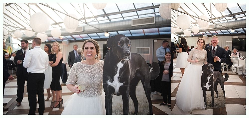 Wedding cake with figurines, on a wood slice. Rustic decor with blurred lights in the background.