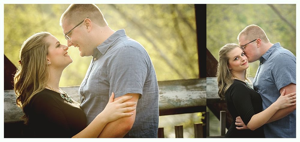Man in suit stands in hotel hallway, smiling.