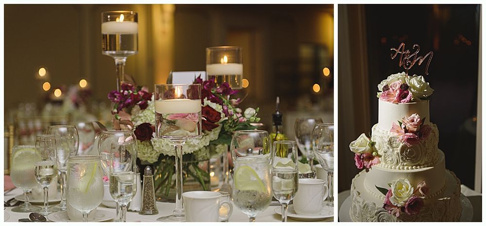 Wedding cake with figurines, on a wood slice. Rustic decor with blurred lights in the background.