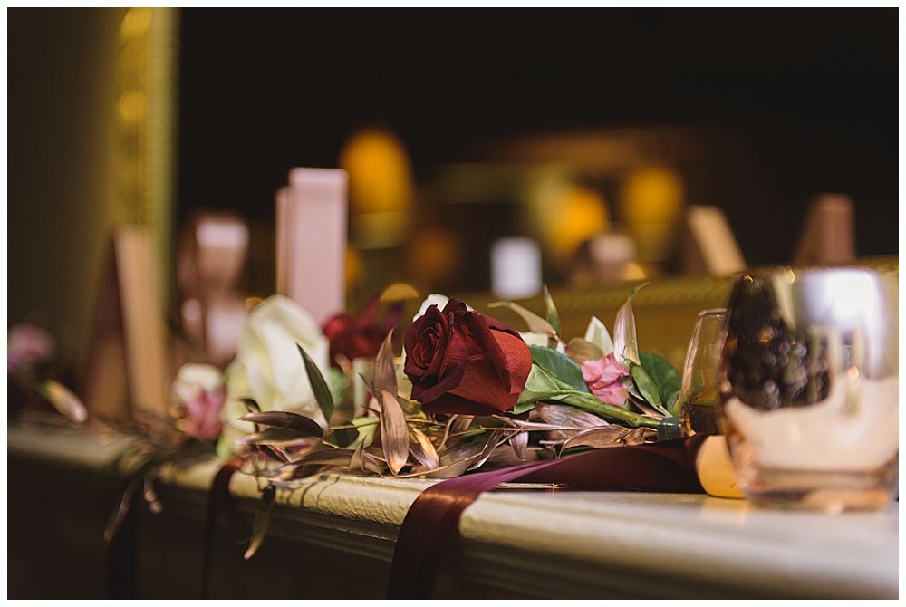 A wedding reception: Bride and groom dance joyfully with guests in a rustic setting, everyone smiling.