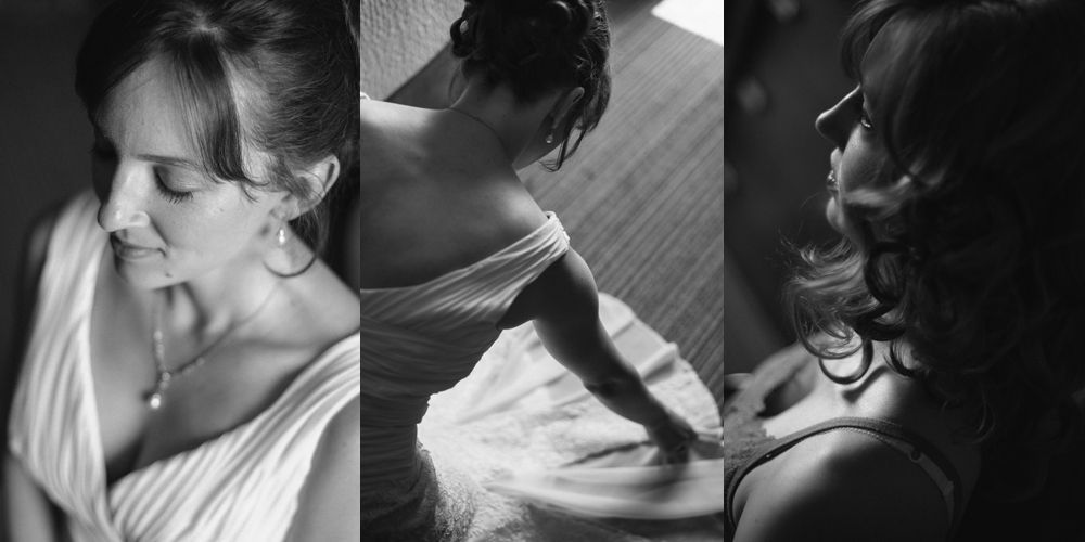 Man in suit stands in hotel hallway, smiling.