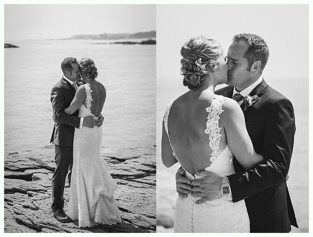 Bride with arms up, making a funny face, groom looking at his hand, cake cutting in background.
