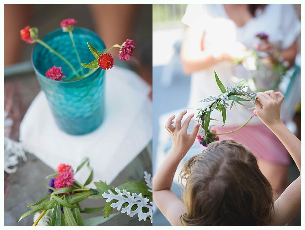 Bride with arms up, making a funny face, groom looking at his hand, cake cutting in background.