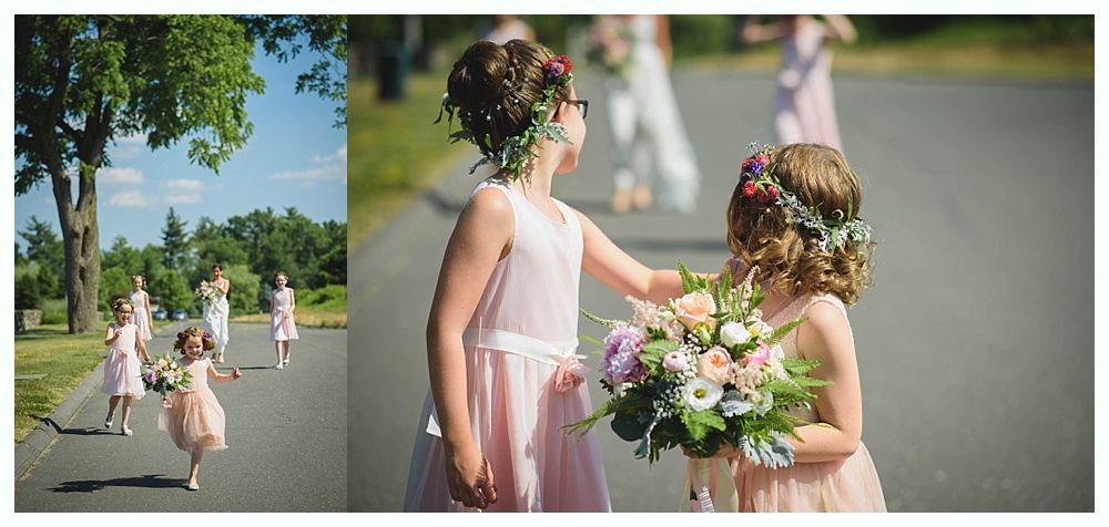 Bride with arms up, making a funny face, groom looking at his hand, cake cutting in background.