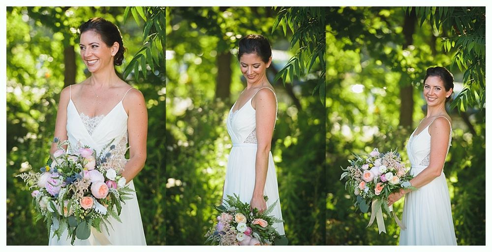 Bride with arms up, making a funny face, groom looking at his hand, cake cutting in background.