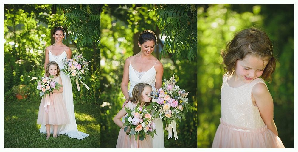 Bride with arms up, making a funny face, groom looking at his hand, cake cutting in background.