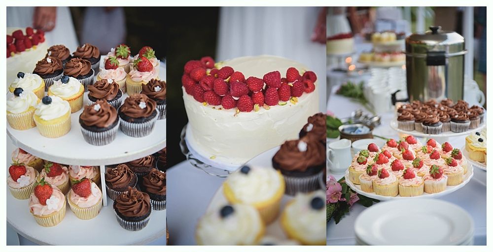 Bride with arms up, making a funny face, groom looking at his hand, cake cutting in background.