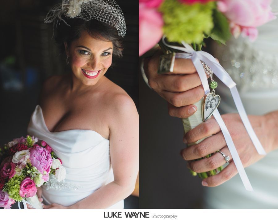 Bride smiling in white strapless dress, holding colorful bouquet. Detail of charm on bouquet's handle.