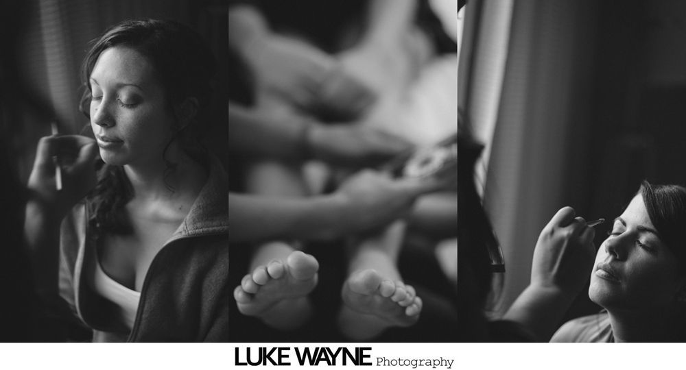 Bridal party in teal robes, bouquet of colorful flowers, and bride putting on bracelet.