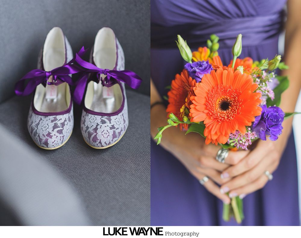 Bride and bridesmaids in teal dresses, with veil; bridesmaids smiling, indoors.