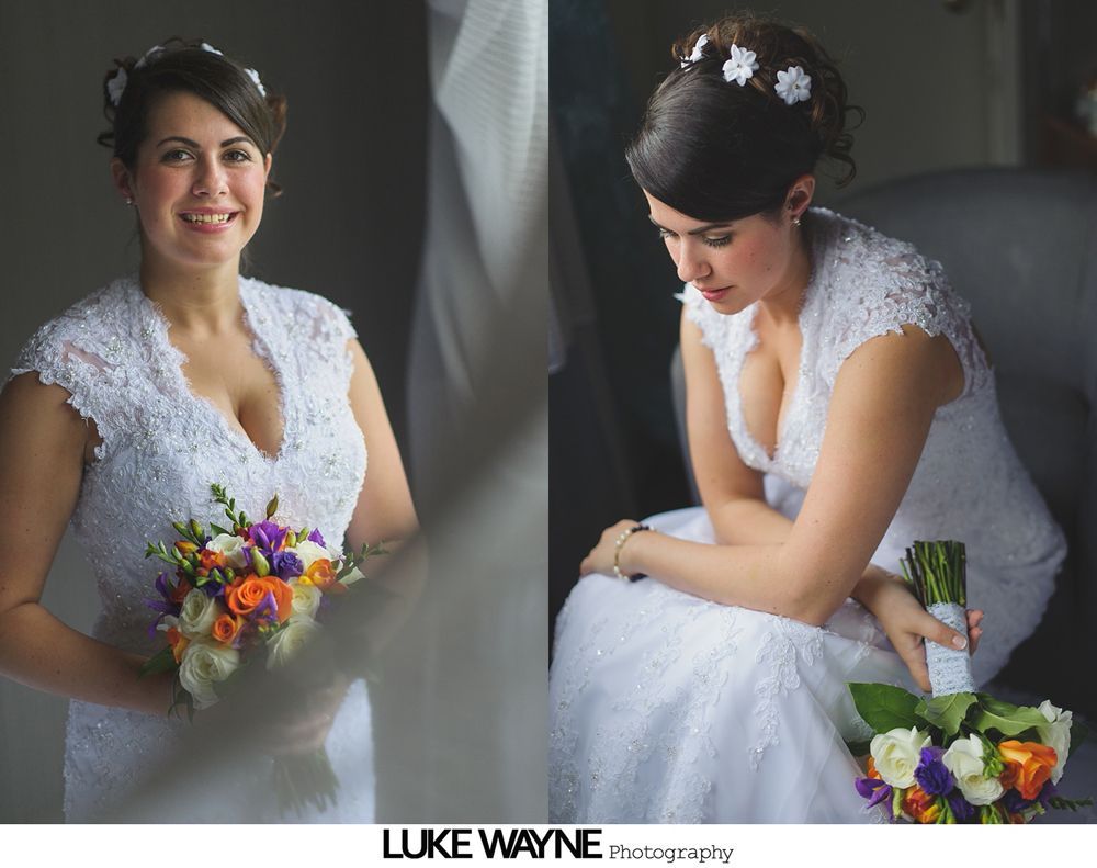 Wedding party, couple in formal attire, posing in a grassy area among trees, black and white photograph.