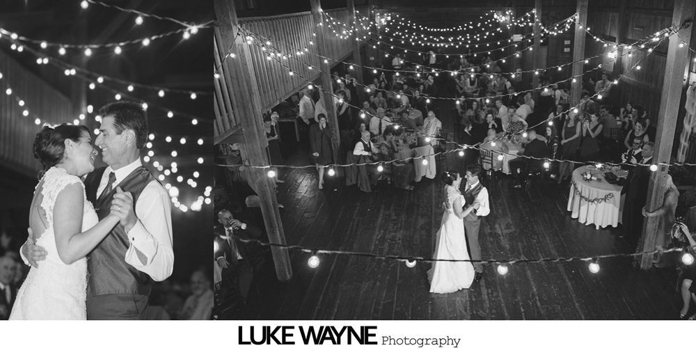 Groom and mother dancing at wedding reception, hands clasped, warm smiles, soft lighting.