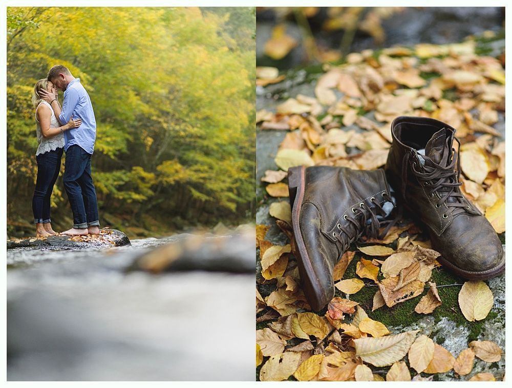 Couple kissing in a stream, surrounded by green foliage. Brown work boots in fallen leaves.