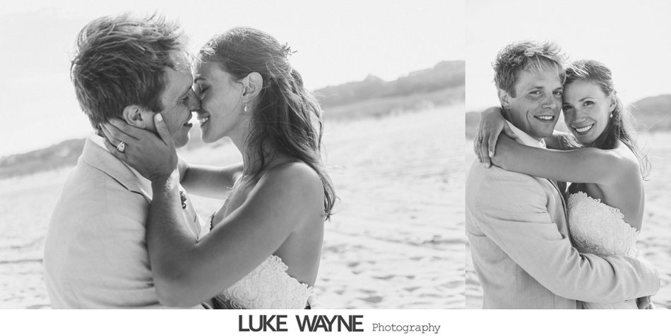 Wedding couple on a beach, embracing and kissing. Black and white photo.