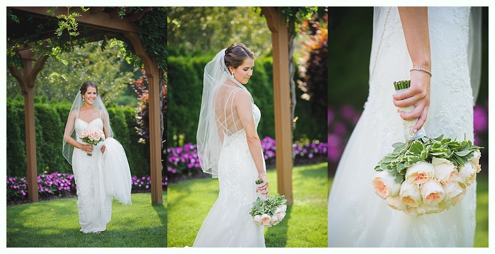 Bride in white gown holding bouquet, posed outdoors. Sunlight streams through trees.