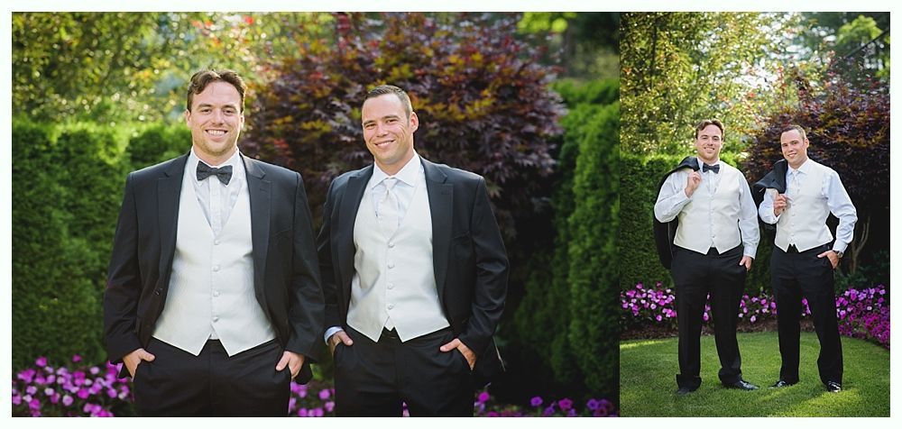 Bride with arms up, making a funny face, groom looking at his hand, cake cutting in background.