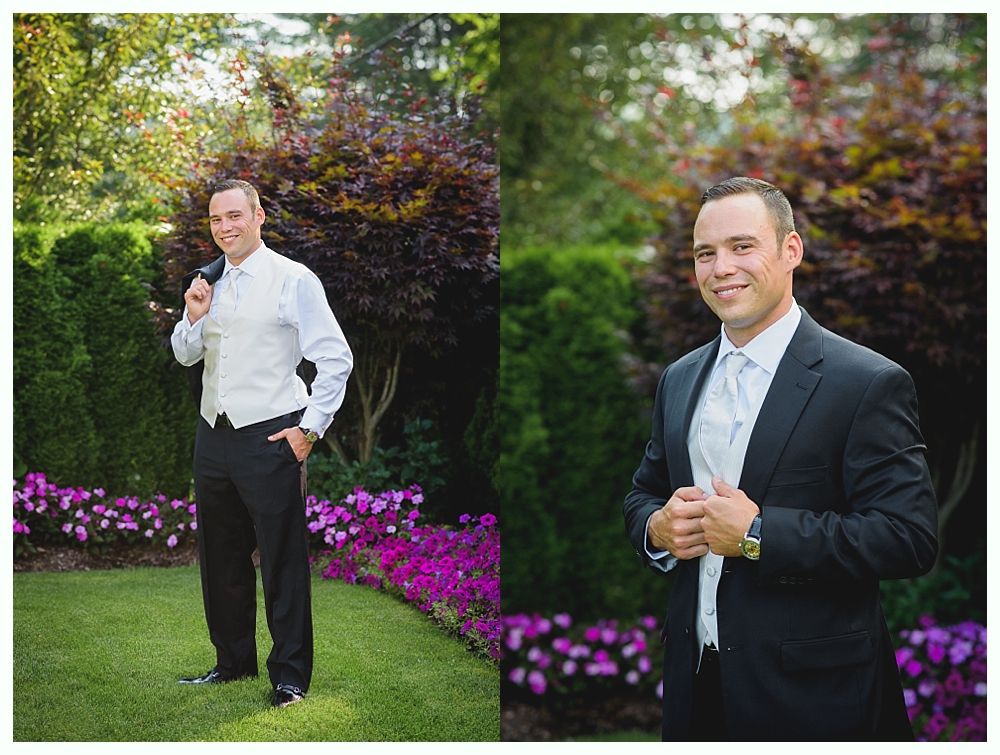 Bride with arms up, making a funny face, groom looking at his hand, cake cutting in background.