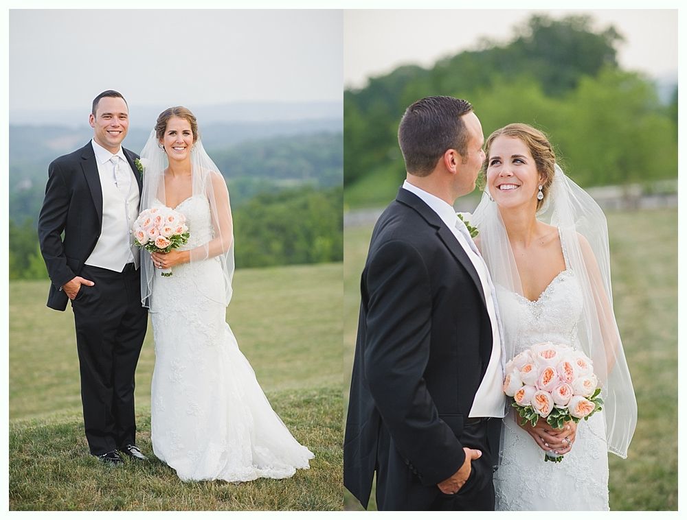 Bride with arms up, making a funny face, groom looking at his hand, cake cutting in background.