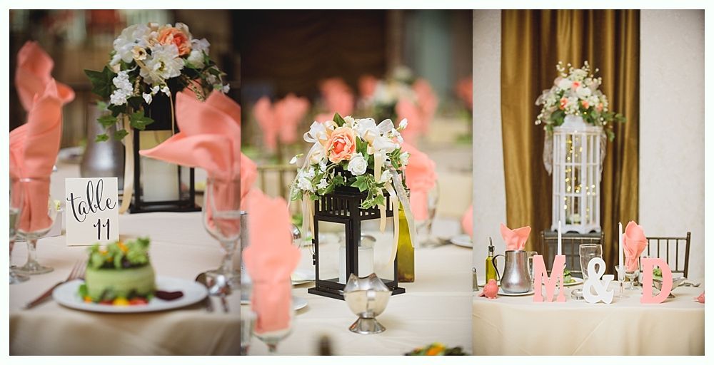 Bride with arms up, making a funny face, groom looking at his hand, cake cutting in background.