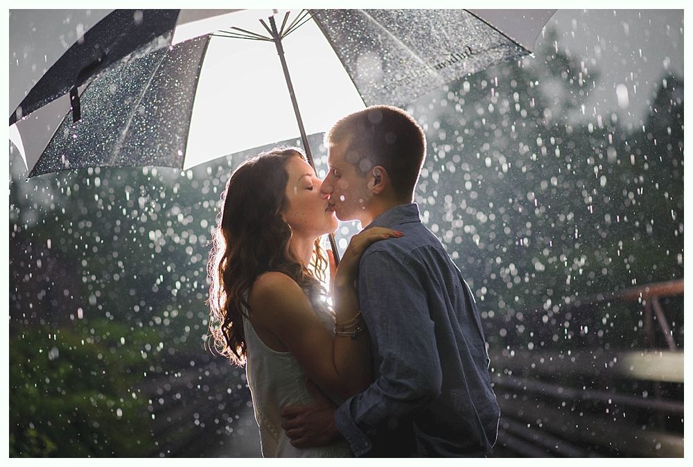 Groom and groomsmen on a beach, wearing suits. Groom in navy pants, others in khaki. All with blue ties, ocean in background.