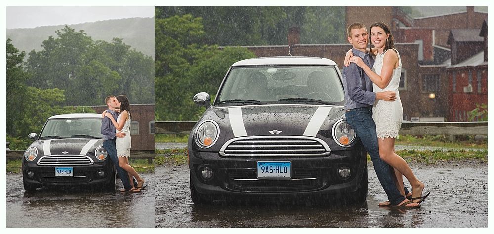 Bride with arms up, making a funny face, groom looking at his hand, cake cutting in background.