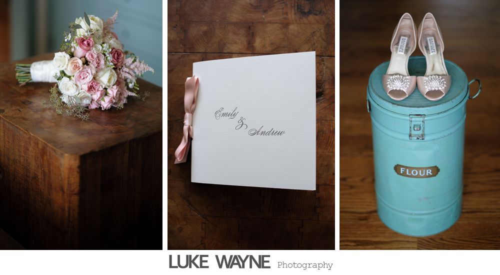 Bride in a fluffy white dress at a bar, smiling. Dark interior, fluorescent lights.
