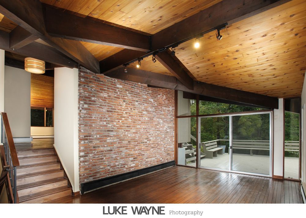 Wedding reception details: cake, flowers, wine, purple and white decor.