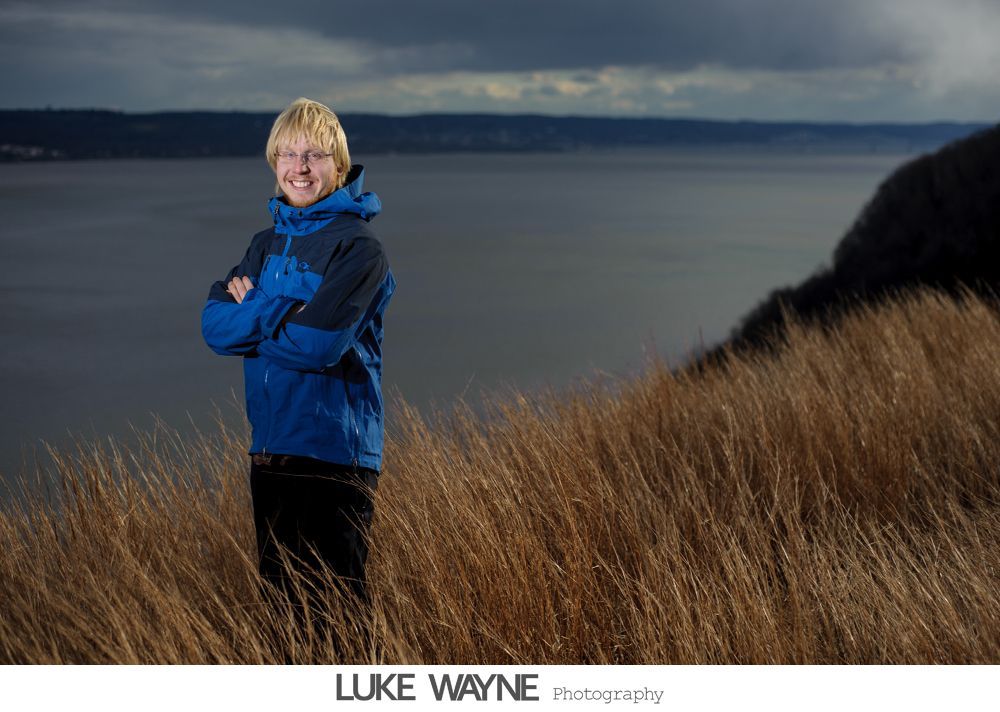 Wedding reception details: cake, flowers, wine, purple and white decor.