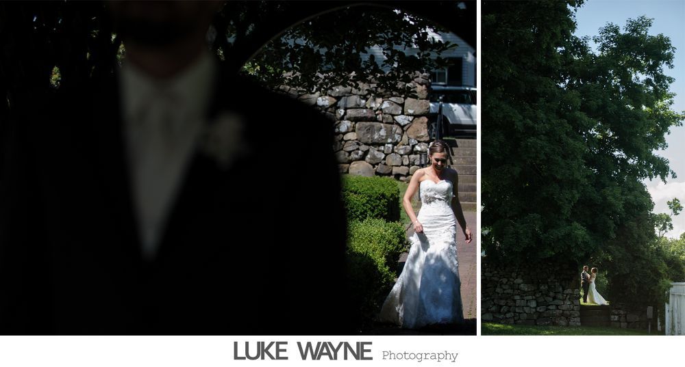 Wedding reception details: cake, flowers, wine, purple and white decor.