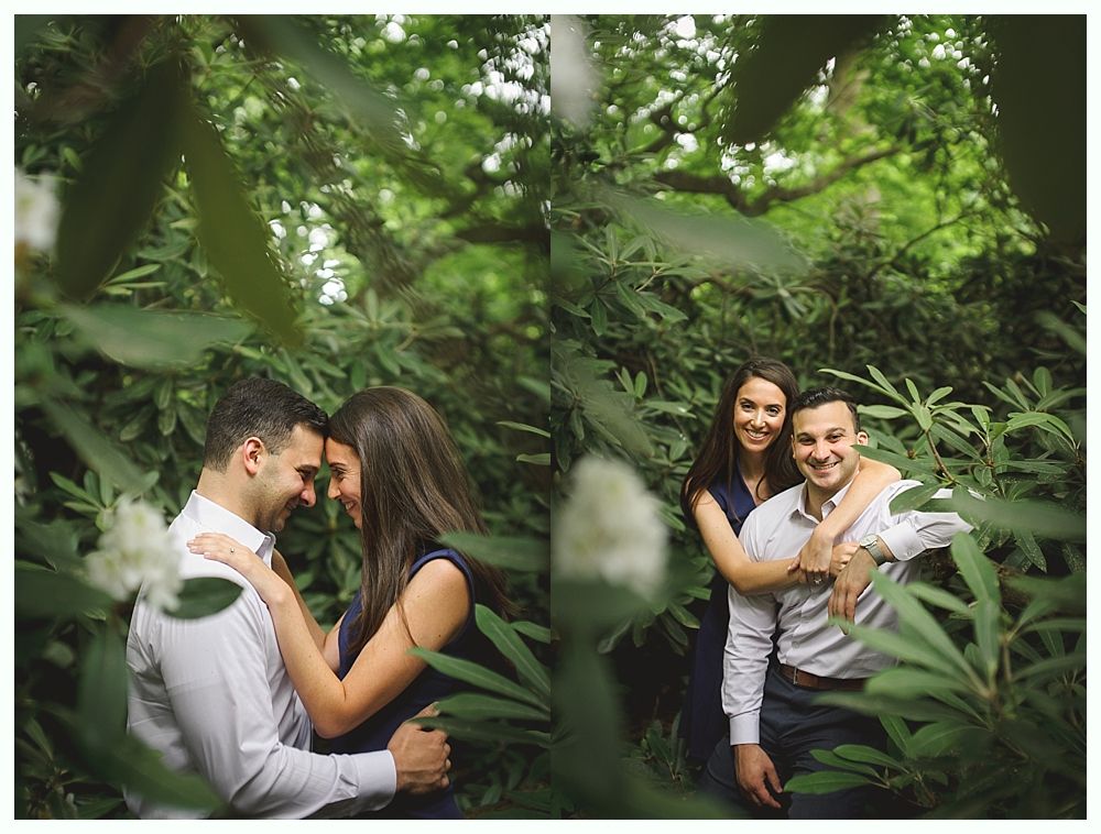 Bride in wedding dress, being helped by bridesmaid, both in a bright room.