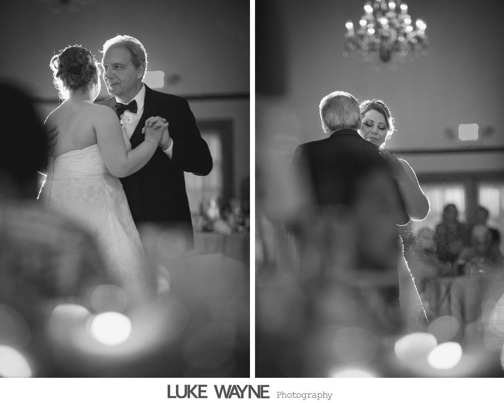 Bride and father dance at wedding reception, soft focus, black and white.